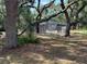 Fenced pool area offers a private, refreshing outdoor space surrounded by mature trees at 3957 Bearded Oaks Ct, Sarasota, FL 34232
