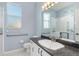 Bathroom featuring sink with granite counters and walk-in shower at 4063 Westbourne Cir, Sarasota, FL 34238