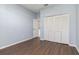Bedroom with closet, hardwood floors, and plenty of space at 4063 Westbourne Cir, Sarasota, FL 34238