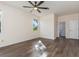 Neutral bedroom with ample space, ceiling fan, and hardwood floors at 4063 Westbourne Cir, Sarasota, FL 34238