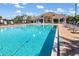 Large community pool with clear blue water and a spacious deck at 4063 Westbourne Cir, Sarasota, FL 34238