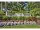 Beautifully landscaped entrance sign for Stoneybrook community with flowers and greenery at 4063 Westbourne Cir, Sarasota, FL 34238