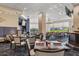 Bright dining room with elegant tables, chairs, and views of the golf course at 4063 Westbourne Cir, Sarasota, FL 34238