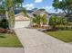 Well-manicured front yard with attractive landscaping and a welcoming entrance at 4063 Westbourne Cir, Sarasota, FL 34238