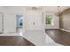 Bright foyer featuring tile flooring, neutral walls, and views into living spaces at 4063 Westbourne Cir, Sarasota, FL 34238