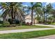 Beautiful single-story home with a well-kept lawn and mature landscaping at 4063 Westbourne Cir, Sarasota, FL 34238