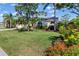 Charming home with well-manicured lawn and colorful flower beds at 4063 Westbourne Cir, Sarasota, FL 34238