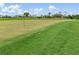A well-manicured green golf course with flag at 4063 Westbourne Cir, Sarasota, FL 34238