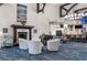 Elegant lobby with comfortable seating, a fireplace, and a view of the dining area at 4063 Westbourne Cir, Sarasota, FL 34238
