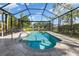 Inviting pool with a relaxing water view and a screened enclosure at 4063 Westbourne Cir, Sarasota, FL 34238