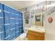 Unique bathroom decorated with Cowboys memorabilia, featuring a shower and vanity at 4211 30Th E Ln, Bradenton, FL 34208