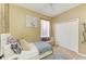 Neutral bedroom features a cozy bed, wall art, and closet space at 4211 30Th E Ln, Bradenton, FL 34208