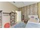 bedroom features a wooden accent wall and ample storage at 4211 30Th E Ln, Bradenton, FL 34208