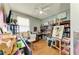Bedroom with a ceiling fan, desk space, and lots of artwork at 4211 30Th E Ln, Bradenton, FL 34208
