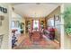 View of dining room with a large oriental rug, display cabinet and access to the billiard room at 4211 30Th E Ln, Bradenton, FL 34208