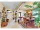 The elegant foyer leads to the dining room and billiard room with tasteful decor and tiled flooring at 4211 30Th E Ln, Bradenton, FL 34208