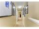 Long hallway decorated with sports memorabilia, offering a glimpse into other rooms at 4211 30Th E Ln, Bradenton, FL 34208