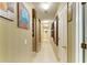 Neutral hallway with an archway, tan walls, and white doors at 4211 30Th E Ln, Bradenton, FL 34208