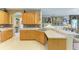 Corner of the kitchen boasting wood cabinetry and a wraparound countertop, perfect for entertaining guests at 4211 30Th E Ln, Bradenton, FL 34208