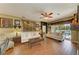 Bright living room with hardwood floors, white sofas, and view of the outdoor space at 4211 30Th E Ln, Bradenton, FL 34208