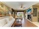 Cozy living room with hardwood floors, a fireplace and a tv on the mantel at 4211 30Th E Ln, Bradenton, FL 34208