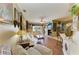 Bright living room with hardwood floors, fireplace, and comfortable white sofa at 4211 30Th E Ln, Bradenton, FL 34208