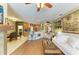 Open-concept living space with tile and wood floors, seamless flow into the dining room and kitchen at 4211 30Th E Ln, Bradenton, FL 34208