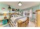 Bright bedroom features a large bed, a window, and stylish decor at 4211 30Th E Ln, Bradenton, FL 34208