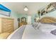 Charming main bedroom with a unique bedframe, soft color palette, and en suite bathroom at 4211 30Th E Ln, Bradenton, FL 34208