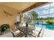 Charming patio featuring an outdoor grill, dining set, and serene water view at 4211 30Th E Ln, Bradenton, FL 34208