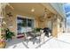 Inviting outdoor patio with a grill, dining set, and tranquil water view at 4211 30Th E Ln, Bradenton, FL 34208