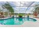 Sparkling screened pool with lake view and decorative planters for relaxing Florida lifestyle at 4211 30Th E Ln, Bradenton, FL 34208