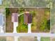 Aerial view of property showing the home, detached garage, and surrounding yard with boundary lines at 4466 Manila Ave, North Port, FL 34288