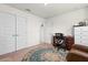 Bright room featuring two large closets, an area rug, and a desk with an office chair at 4466 Manila Ave, North Port, FL 34288