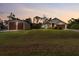 Charming home with lush front lawn and detached garage, perfect for storage or hobbies at 4466 Manila Ave, North Port, FL 34288