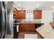 Modern kitchen with stainless steel appliances, granite countertops, and undermount sink at 4466 Manila Ave, North Port, FL 34288