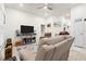 Spacious living room with neutral decor and lots of natural light, perfect for relaxing and entertaining at 4466 Manila Ave, North Port, FL 34288