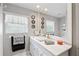 Bathroom featuring marble countertop, framed mirror and modern finishes at 490 Pine Lily Way, Venice, FL 34293
