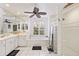 Bright bathroom featuring double vanity, garden tub, glass block window and walk-in shower at 490 Pine Lily Way, Venice, FL 34293