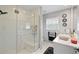 Bright bathroom featuring large glass enclosed shower, and modern finishes at 490 Pine Lily Way, Venice, FL 34293