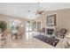 Open dining area with elegant furnishings, beautiful chandelier, and easy access to the living area at 490 Pine Lily Way, Venice, FL 34293