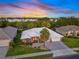 Beautifully landscaped front exterior with a well-manicured lawn and charming curb appeal at 490 Pine Lily Way, Venice, FL 34293