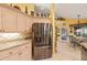 Bright kitchen featuring stainless steel refrigerator and access to breakfast nook at 490 Pine Lily Way, Venice, FL 34293
