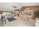 Bright and open living room featuring tile floors, and neutral decor at 490 Pine Lily Way, Venice, FL 34293