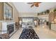 Comfortable living room featuring a fireplace, tiled flooring, and stylish furnishings at 490 Pine Lily Way, Venice, FL 34293