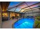 Enclosed pool area with swim-up bar and direct access to the interior living areas at 490 Pine Lily Way, Venice, FL 34293