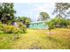 Lush backyard with tropical plants and a view of the exterior of the house at 4922 18Th E St, Bradenton, FL 34203