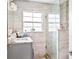 Modern bathroom featuring a glass-enclosed shower, stylish vanity, and neutral-toned tile at 4922 18Th E St, Bradenton, FL 34203