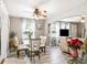 Inviting open-concept living space with a glass dining table and comfortable seating, perfect for entertaining at 4922 18Th E St, Bradenton, FL 34203