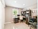 Bright office with tile floors and a built-in desk and shelving for optimal organization at 4922 18Th E St, Bradenton, FL 34203
